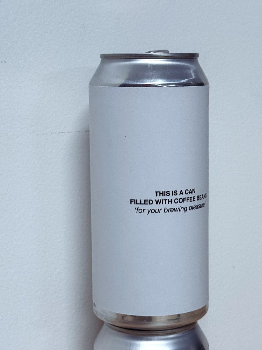 A CAN FILLED WITH COFFEE BEANS